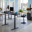 electric standing desk in an office setting