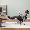 model sitting in chair reclined back