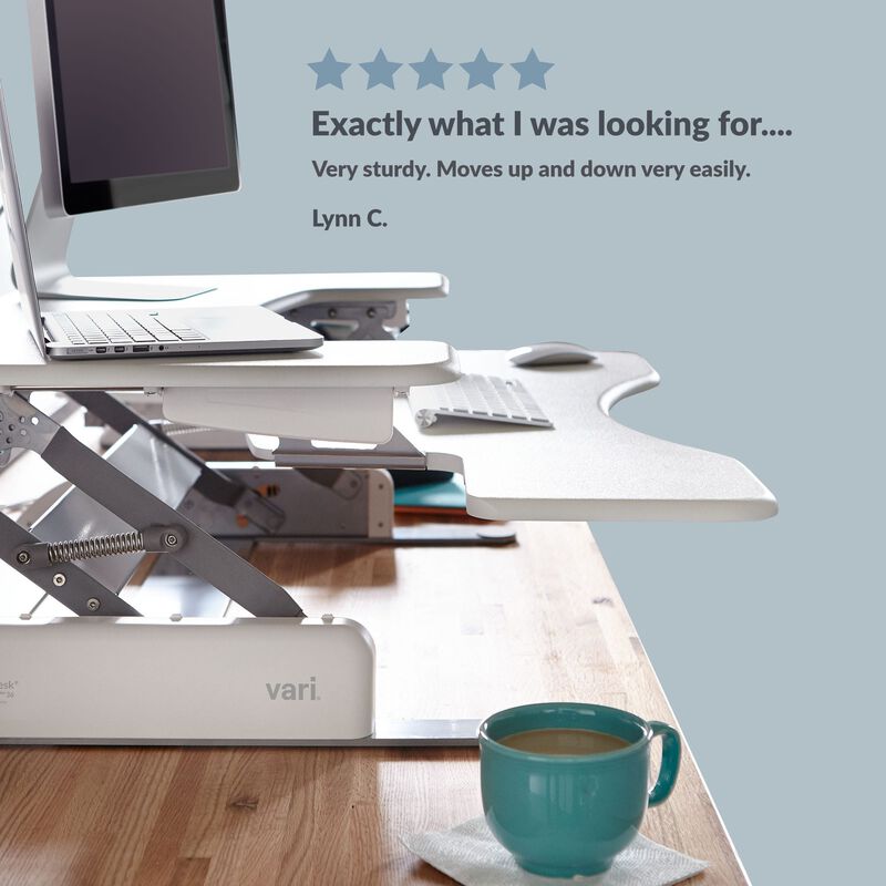 Front view of the converter in a raised position on a desk with a five star review customer quote. image number null