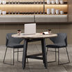 shadow grey cafe chairs around round table in lounge setting