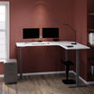marble finish l shape electric standing desk in a raised position in the corner of a workspace