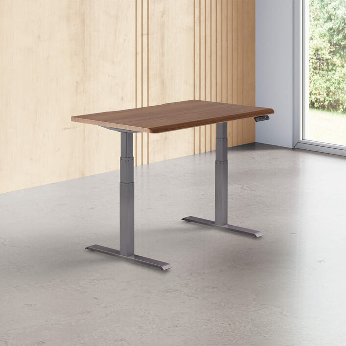 walnut finish standing desk top with slate legs in a open office image number 0