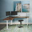 l shape electric standing desk eighty by eighty in a lowered position