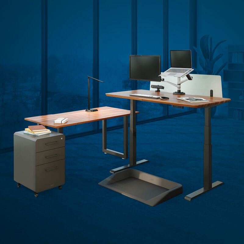 Electric Standing Desk and benching table in office with large windows image number null