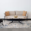 contemporary three-seat sofa in pebble placed in office setting with the contemporary coffee table