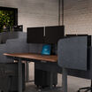 privacy desk surround 72 in light grey felt on an electric standing desk in walnut finish