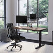 Electric Standing Desk 60x30 walnut black legs in lowered position at home