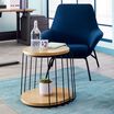 round side table and arm chair create lounge area 