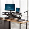 VariDesk&reg; Cube Plus&reg; 40 Black in raised position at office