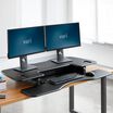 VariDesk&reg; Pro Plus&trade; 48 Black in lowered position at office