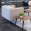 angled view of the back of the aspire side chair in a lounge setting