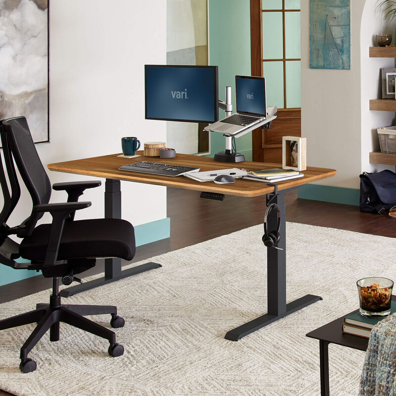 Electric Standing Desk 60x30 Butcher Block in lowered position at home image number null