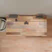 Overhead view of a reclaimed wood TechTrack ESD desktop showing built-in cable management channels fitted with mounting clips and a cord tray, set against a wood floor and cushioned bench.
