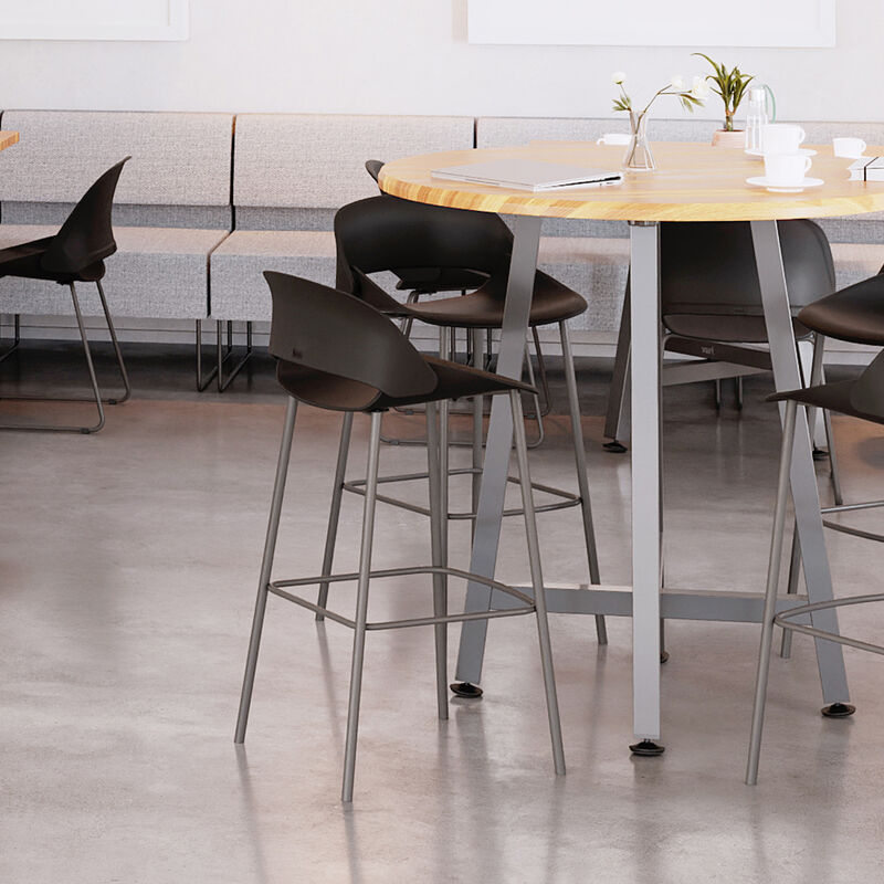 four tall wave side chairs around a tall round table in a lounge area image number null