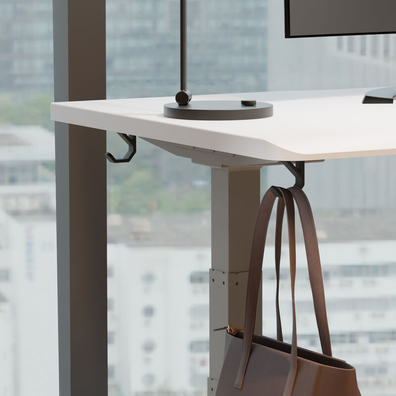 zoomed in vari undermount bag hook attached to desk with a purse hanging on image number null