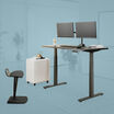 Posture perfect bundle setup in a workspace with an electric standing desk a dual monitor arm a file cabinet and active seat 