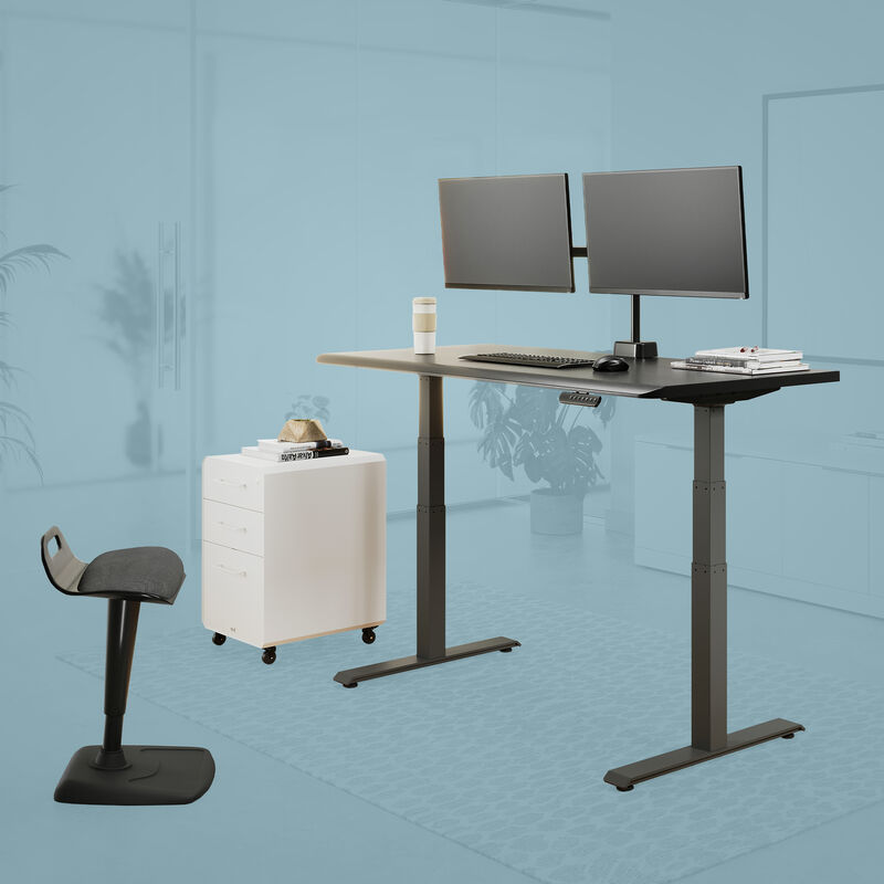 Posture perfect bundle setup in a workspace with an electric standing desk a dual monitor arm a file cabinet and active seat  image number null