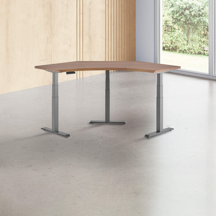 walnut finish standing desk top with slate finish legs in a open office image number 0
