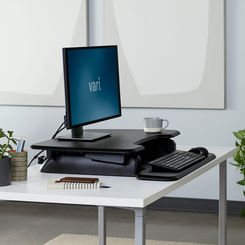 vari essential 30 - open box in black lowered in an office setting image number null