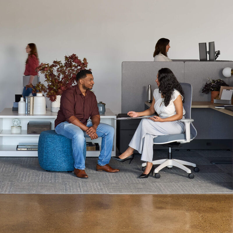 individuals working in an open office setting image number null