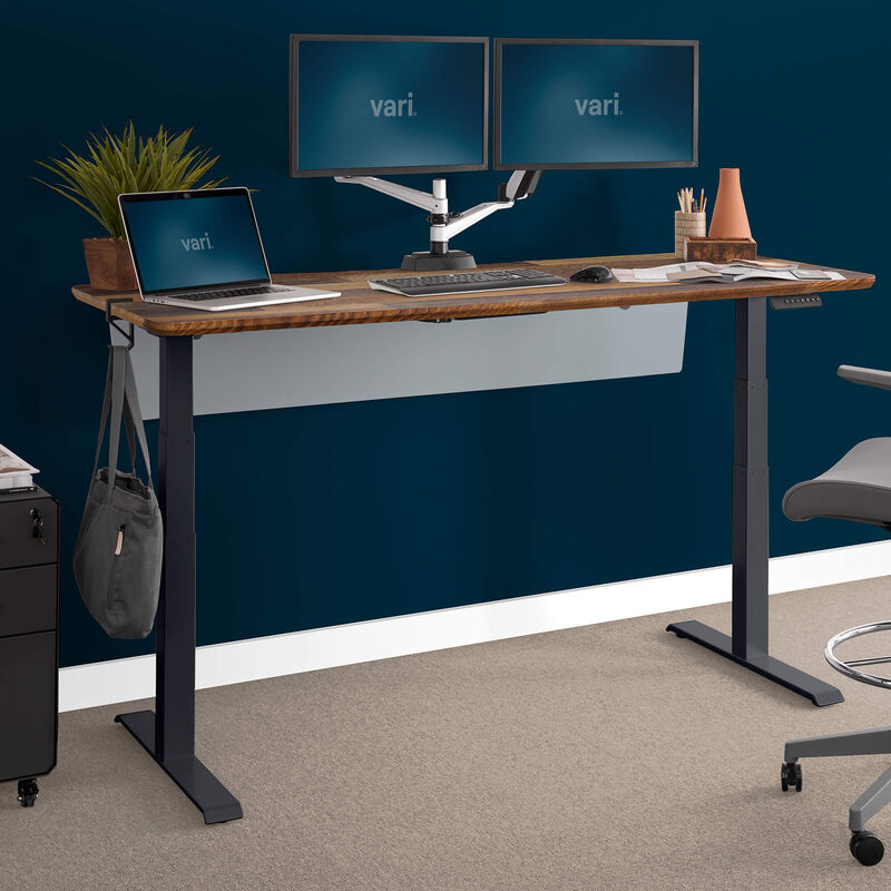 acrylic modesty panel 72 attached for modesty to Electric Standing Desk 72 by 30 in a home office setting image number null
