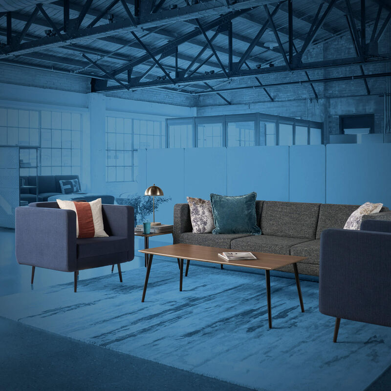 two chairs and a couch in an open office setting with a blue mask over the rest of the office space image number null