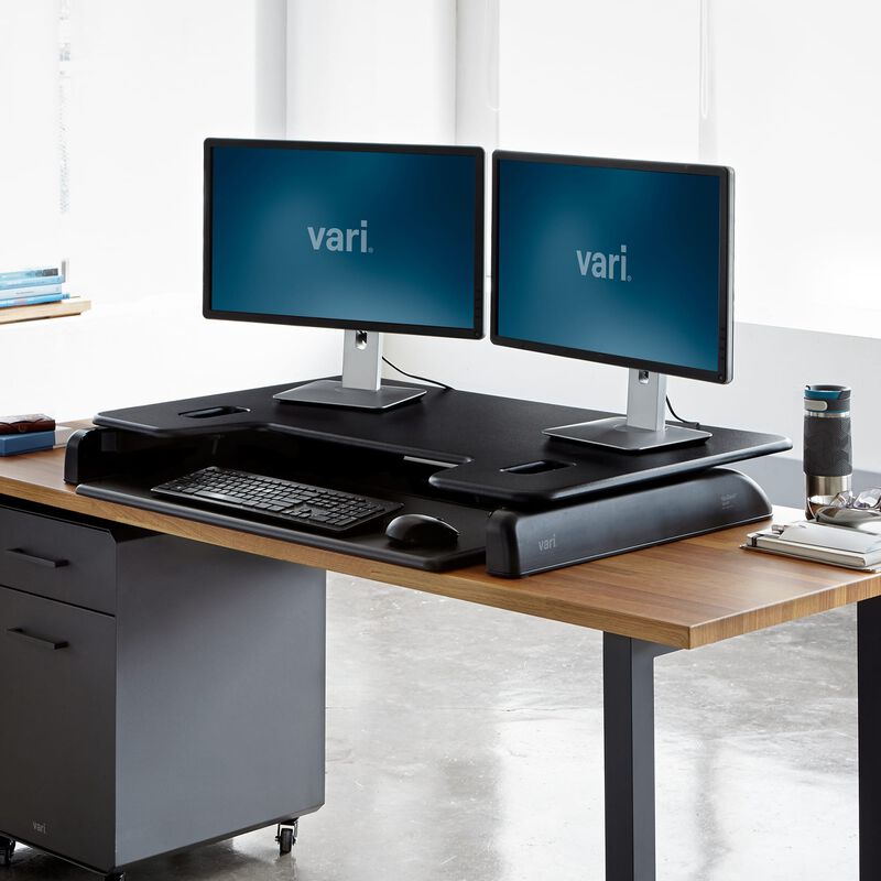 VariDesk Tall 40 Black in lowered position at office image number null