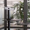 premier monitor mount in the black finish setup on the premier electric single monitor on a table top workspace in office environment