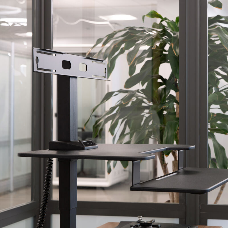 premier monitor mount in the black finish setup on the premier electric single monitor on a table top workspace in office environment image number null
