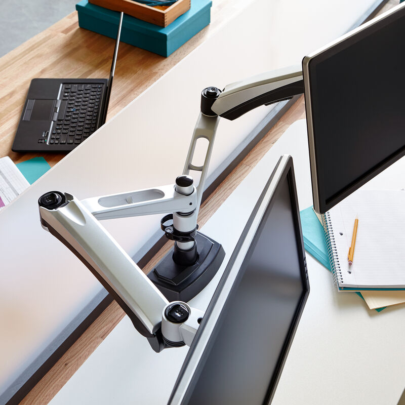 overhead view of dual-monitor arm in office holding two monitors image number null