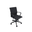 Three-quarter view of black mesh Vari Studio Chair with curved armrests and five-caster base on a white background.