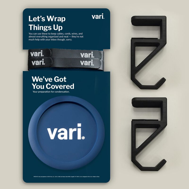 Three extra accessories, cable wraps, coaster and desk hooks in their packaging.  image number null