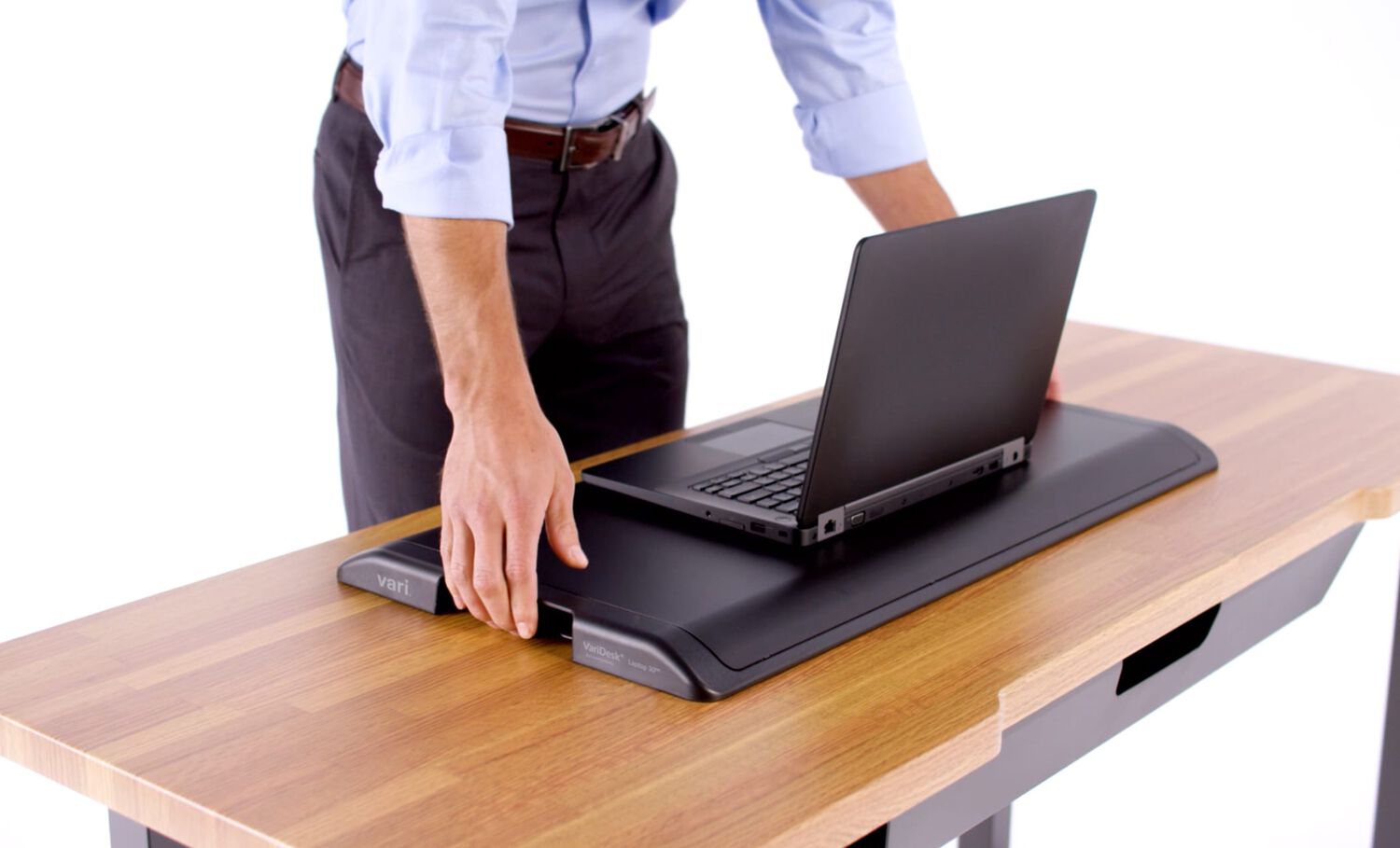 Individual using varidesk laptop 30 in collapsed position 