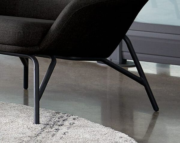 close up view of arm chair steel legs 