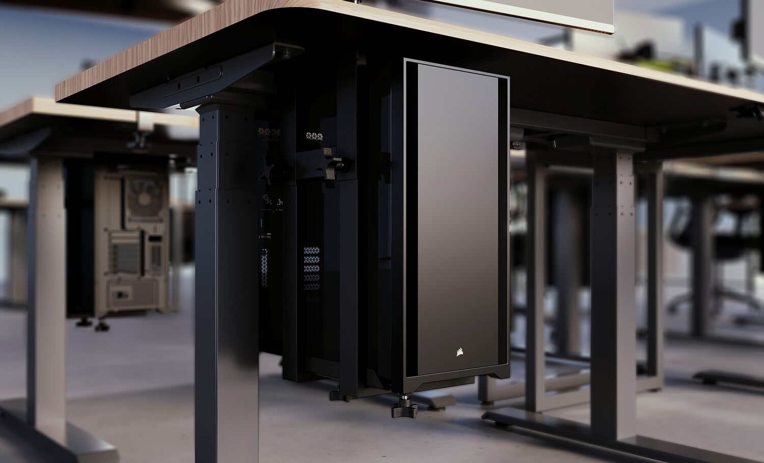 Close-up of a black PC tower mounted under a wooden height-adjustable desk using a secure mount, ideal for space-saving and clean cable management in modern office setups