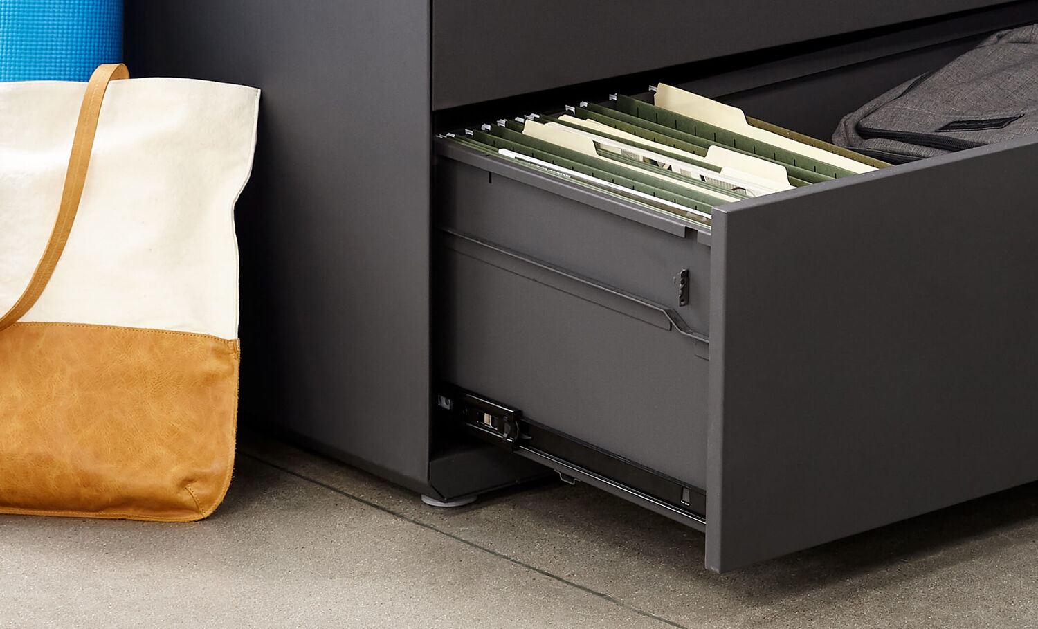 close up view of open drawer of lateral file cabinet