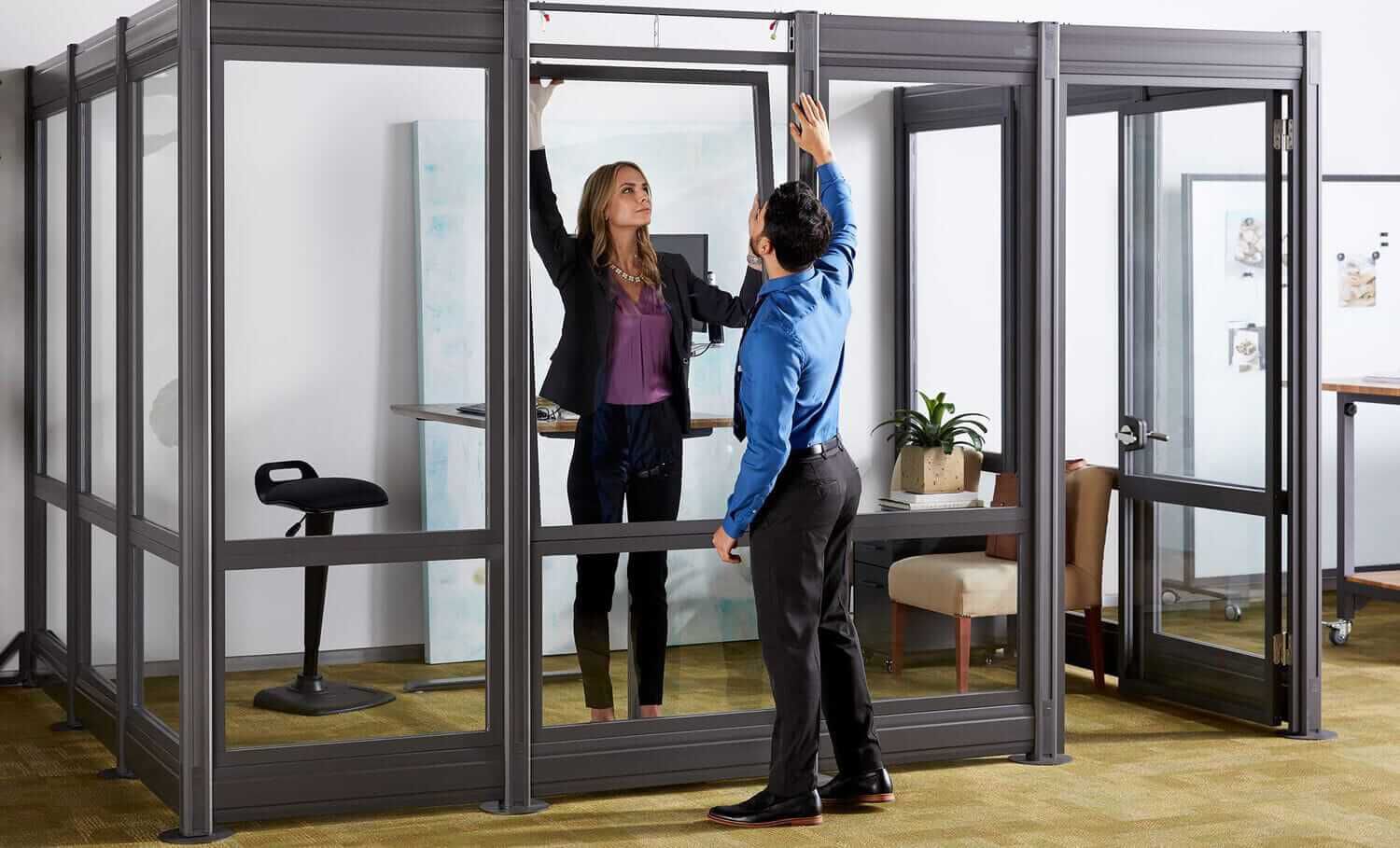 professionals collaborate in a conference room with Vari conference table, chairs, and accessories