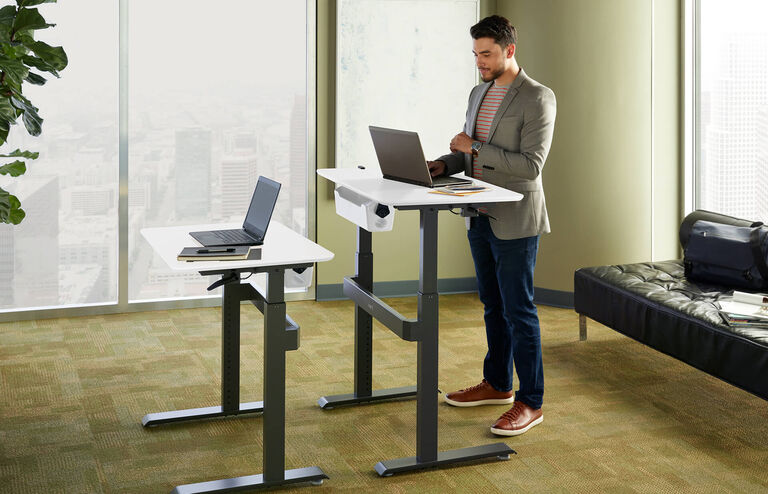 professional working in office with vari standing work station 36 by 24