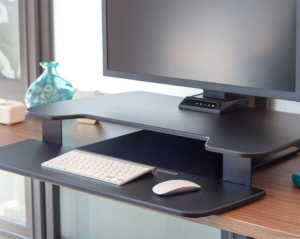 electric converter in raised position on top of a desk