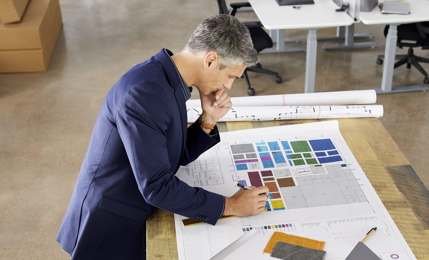 Vari space planner reviews floor plan during office installation