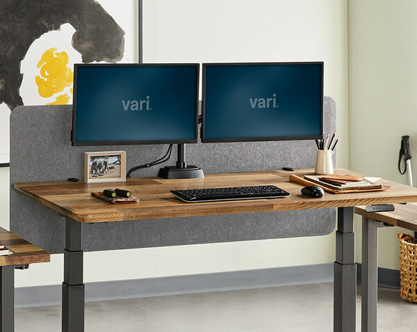 Felt panel seen on desk with monitors