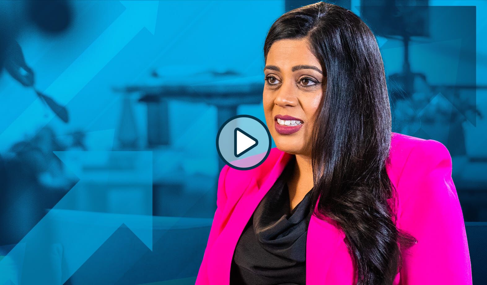 yasmeen tadia sits in an office environment sharing insights