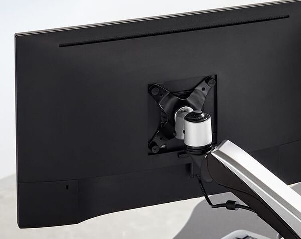 close up shot of the back side of a monitor and the VESA mount where it attaches