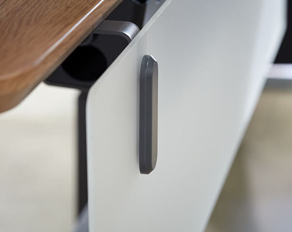frosted acrylic panel with dark gray mounting is attached to desk 