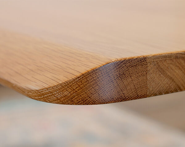 closeup of comfort edge solid wood desk