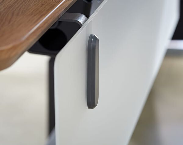 frosted acrylic panel with dark gray mounting is attached to desk 
