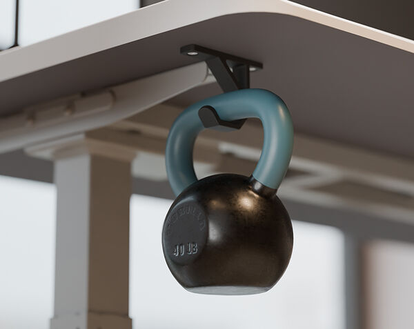 overview of the vari desk hook with a weight of 50 lbs on a desk