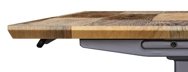 side view of a chamfered edge electric standing desk