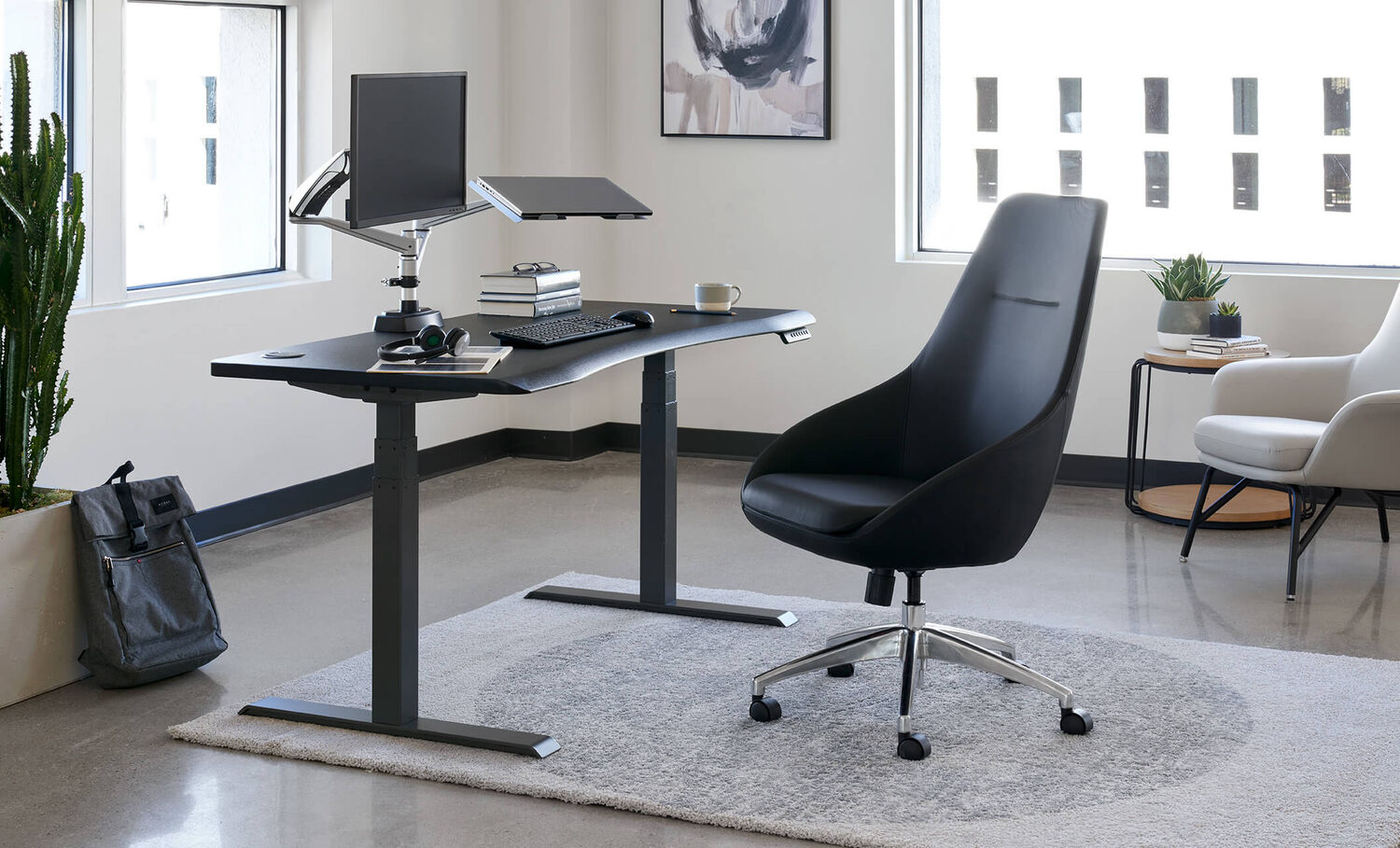 high performance task chair paired with curve electric standing desk create an upscale workspace 