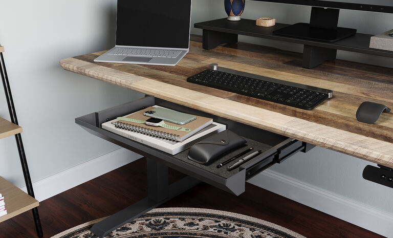 Vari hanging desk cubby mounted on electric standing desk 
